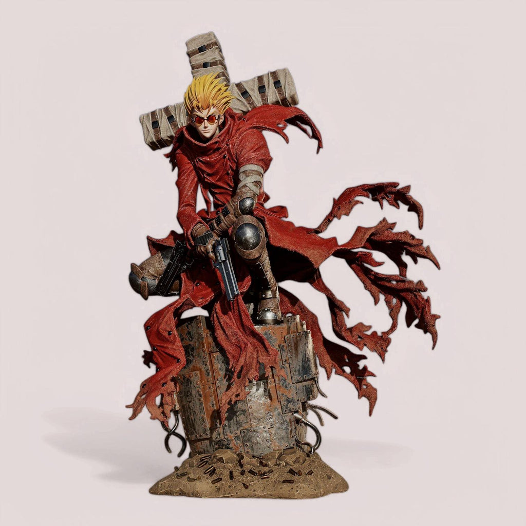 Vash the Stampede figure, posed on a weathered base with tattered red coat flowing. Holds dual revolvers, massive wrapped cross weapon on back. Inspired by Trigun, capturing his dynamic movement and signature look.
