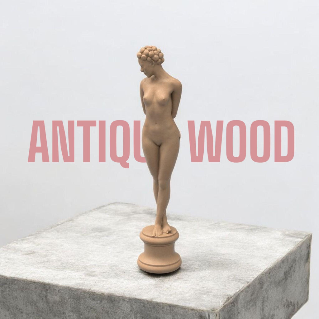 Elegant minimalist sculpture of a nude woman with vintage hair rollers, posed shyly on a round pedestal. “The Woman X” combines classical grace and modern rebellion in one striking collectible.