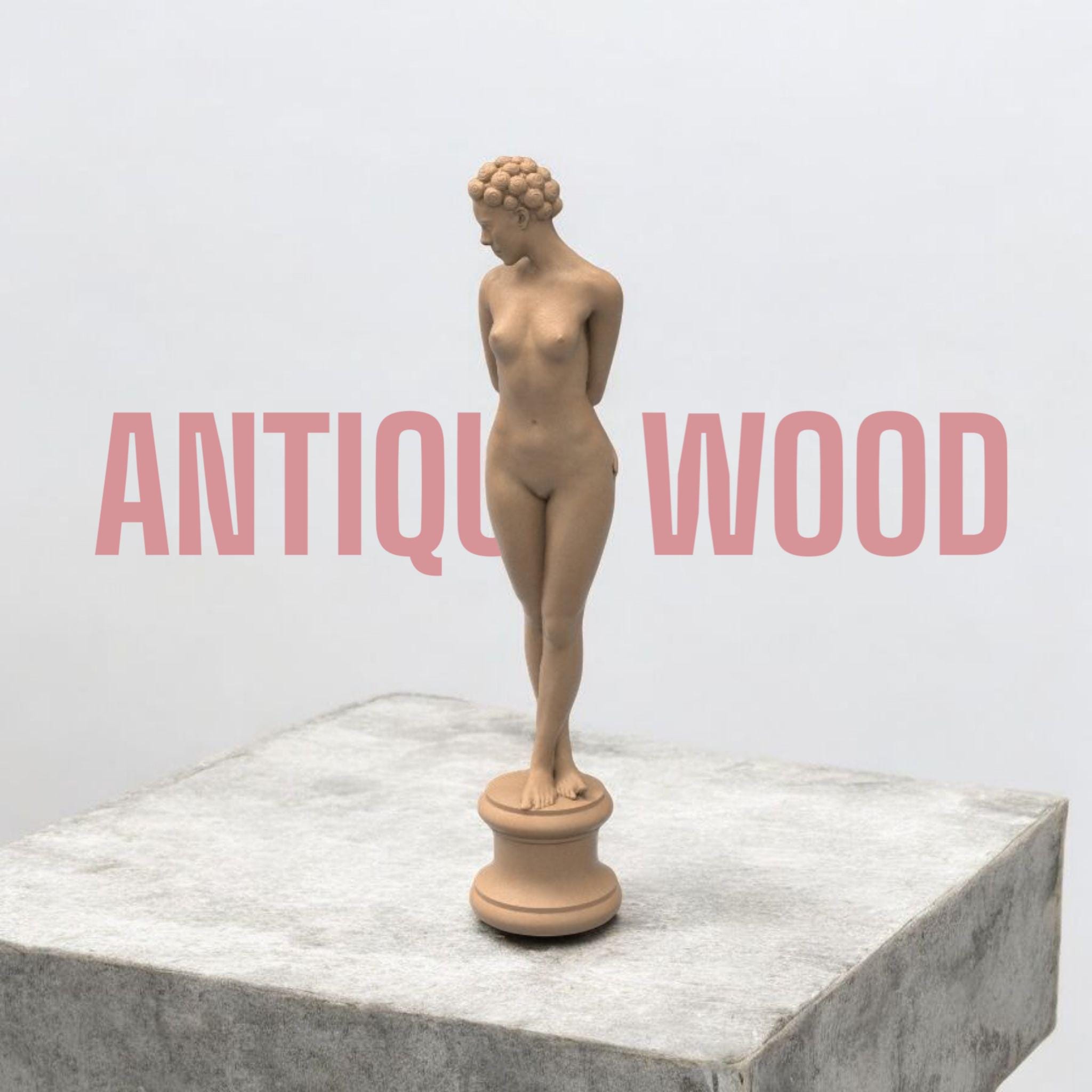 Elegant minimalist sculpture of a nude woman with vintage hair rollers, posed shyly on a round pedestal. “The Woman X” combines classical grace and modern rebellion in one striking collectible.