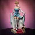 A bold reimagination of the classic princess, this stunning Elaria the Princess of Moonlight statuette blends elegance and seduction. With delicate details from her flowing dress to thigh-high stockings and glass slippers, she steps confidently down the royal stairs—one garter and lost shoe away from a fairytale twist.