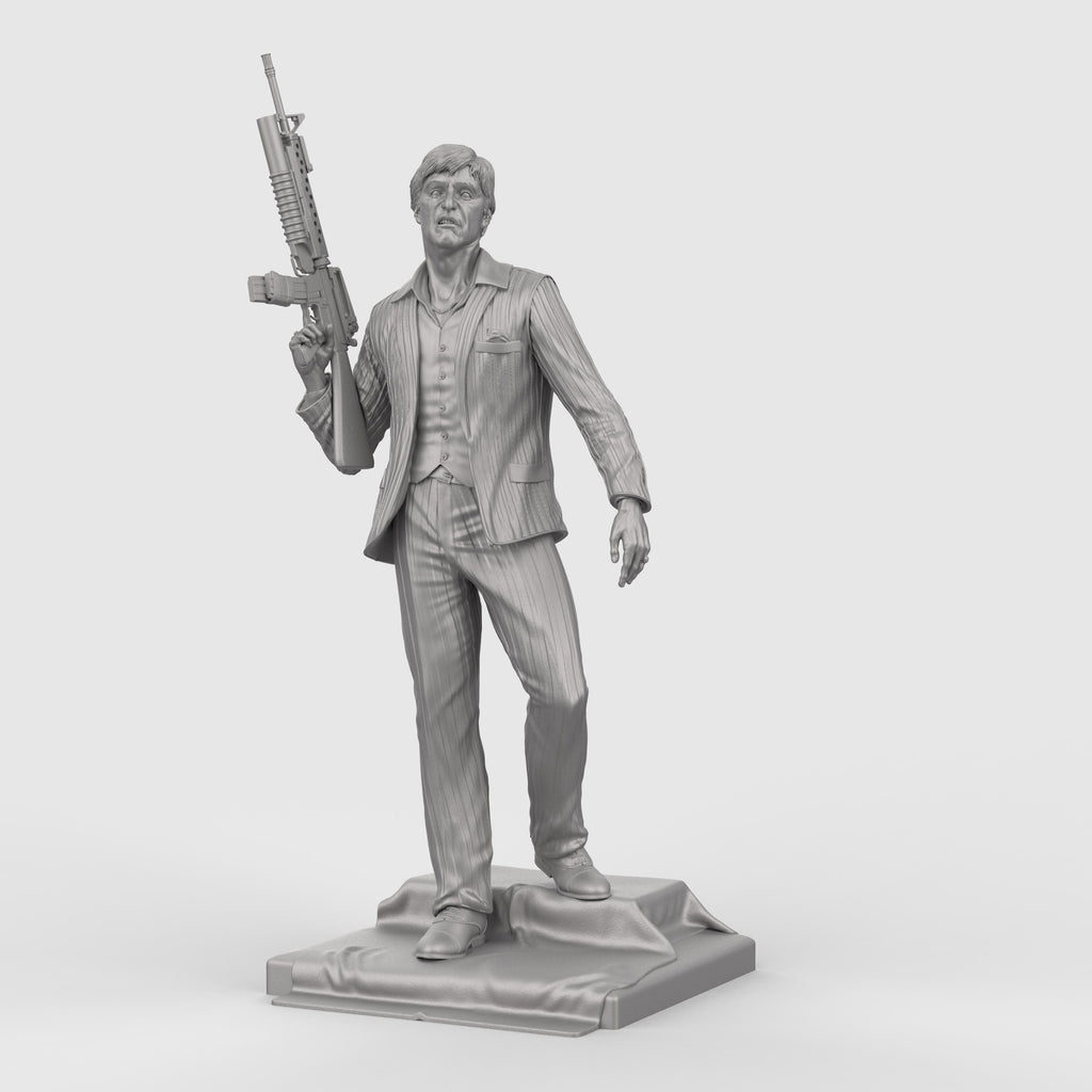 3D-printed statue inspired by Scarface, depicting a suited man in a confident pose, holding an assault rifle over his shoulder. The figure wears a detailed pinstripe suit and stands atop a textured base, capturing a bold and iconic cinematic moment with lifelike facial expression and dynamic stance.