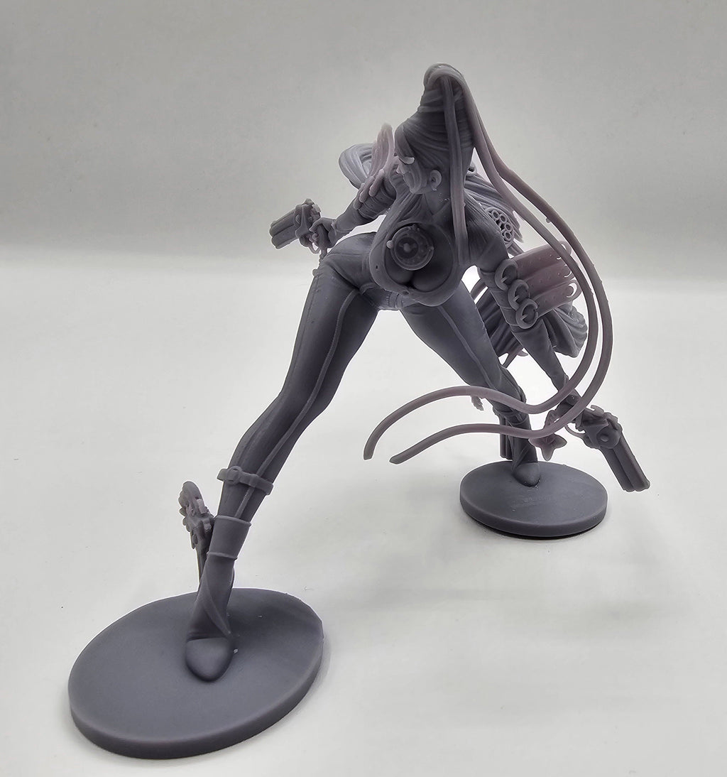 A highly detailed Bayonetta statuette showcasing her dynamic pose with dual guns and flowing hair, capturing her elegance, power, and iconic style from the video game series.