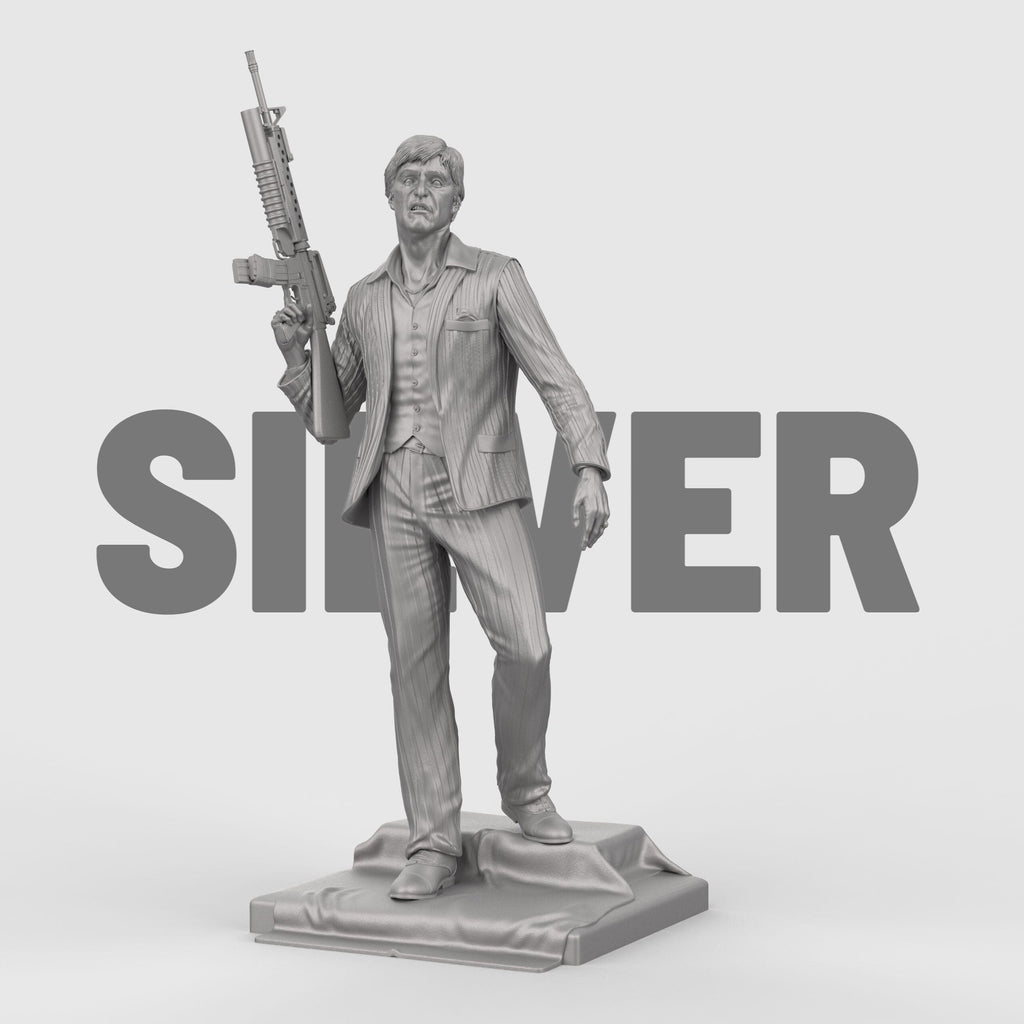 3D-printed statue inspired by Scarface, depicting a suited man in a confident pose, holding an assault rifle over his shoulder. The figure wears a detailed pinstripe suit and stands atop a textured base, capturing a bold and iconic cinematic moment with lifelike facial expression and dynamic stance.
