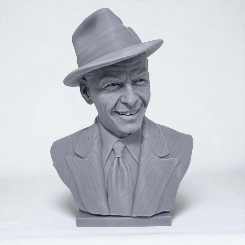 3D-printed bust of Frank Sinatra wearing a classic fedora and suit with a wide smile, showcasing detailed facial features and textured clothing. A tribute piece perfect for fans, collectors, or display décor.