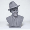 3D-printed bust of Frank Sinatra wearing a classic fedora and suit with a wide smile, showcasing detailed facial features and textured clothing. A tribute piece perfect for fans, collectors, or display décor.