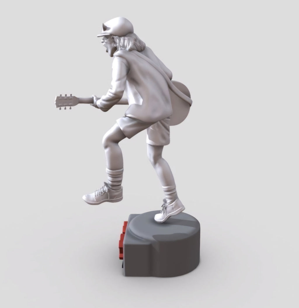 Statue of Angus Young from AC DC, depicted in a dynamic pose with his iconic guitar and schoolboy uniform, standing on a base engraved with the band&#39;s logo.