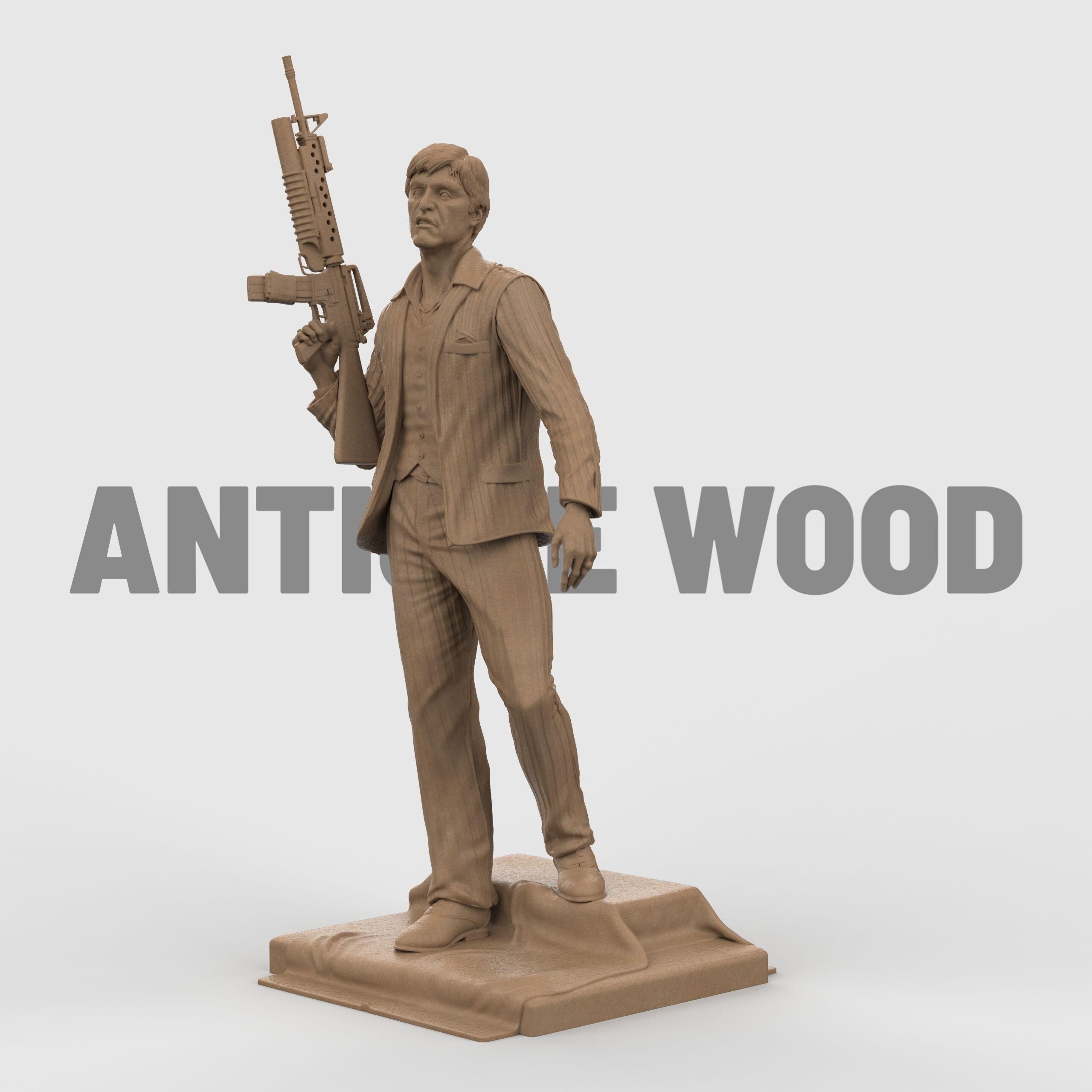 3D-printed statue inspired by Scarface, depicting a suited man in a confident pose, holding an assault rifle over his shoulder. The figure wears a detailed pinstripe suit and stands atop a textured base, capturing a bold and iconic cinematic moment with lifelike facial expression and dynamic stance.