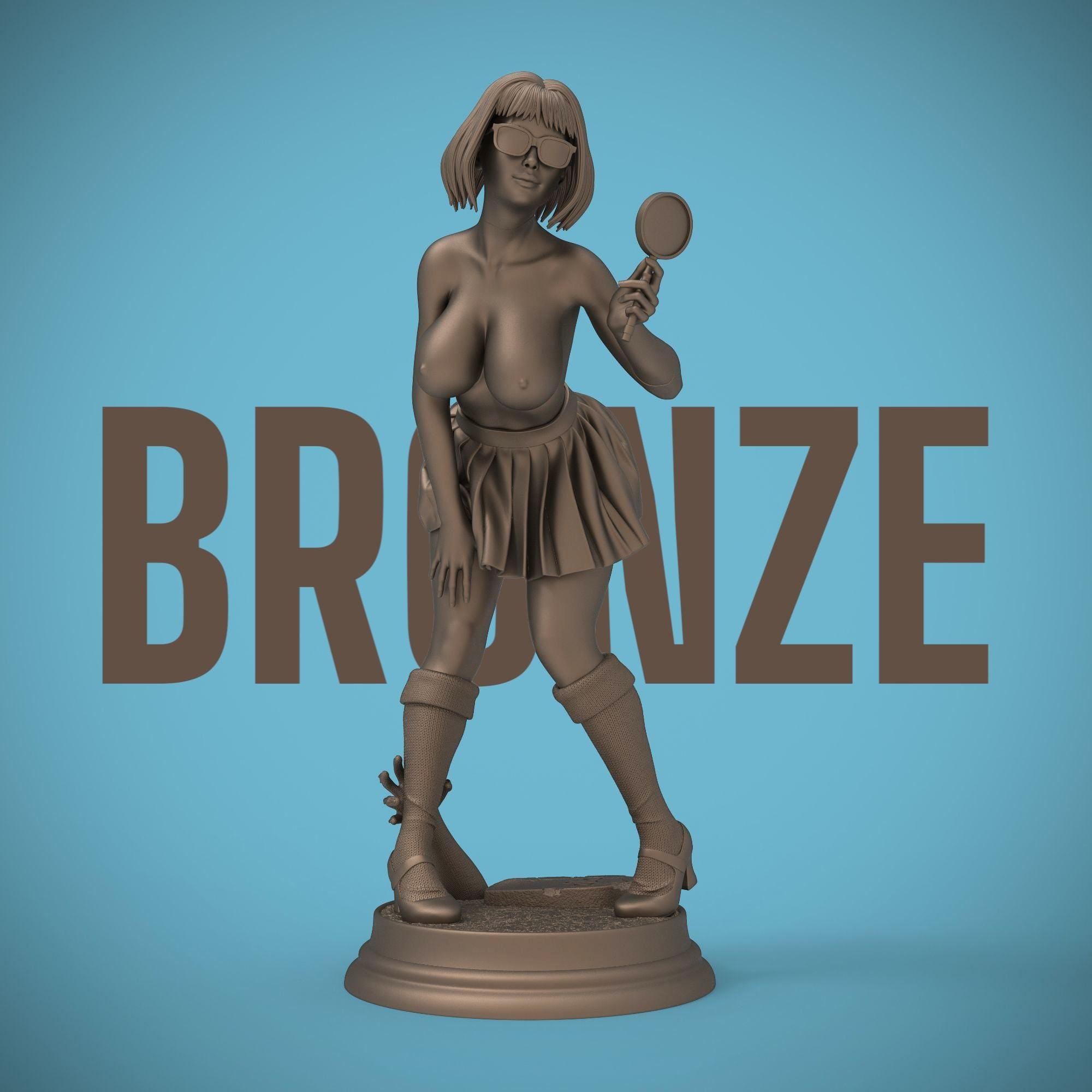 A cheeky twist on the classic mystery solver. This curvy Velma-inspired figurine captures her playful spirit with a magnifying glass in hand and a mischievous grin. A perfect blend of sass and smarts, sculpted in high detail for collectors.