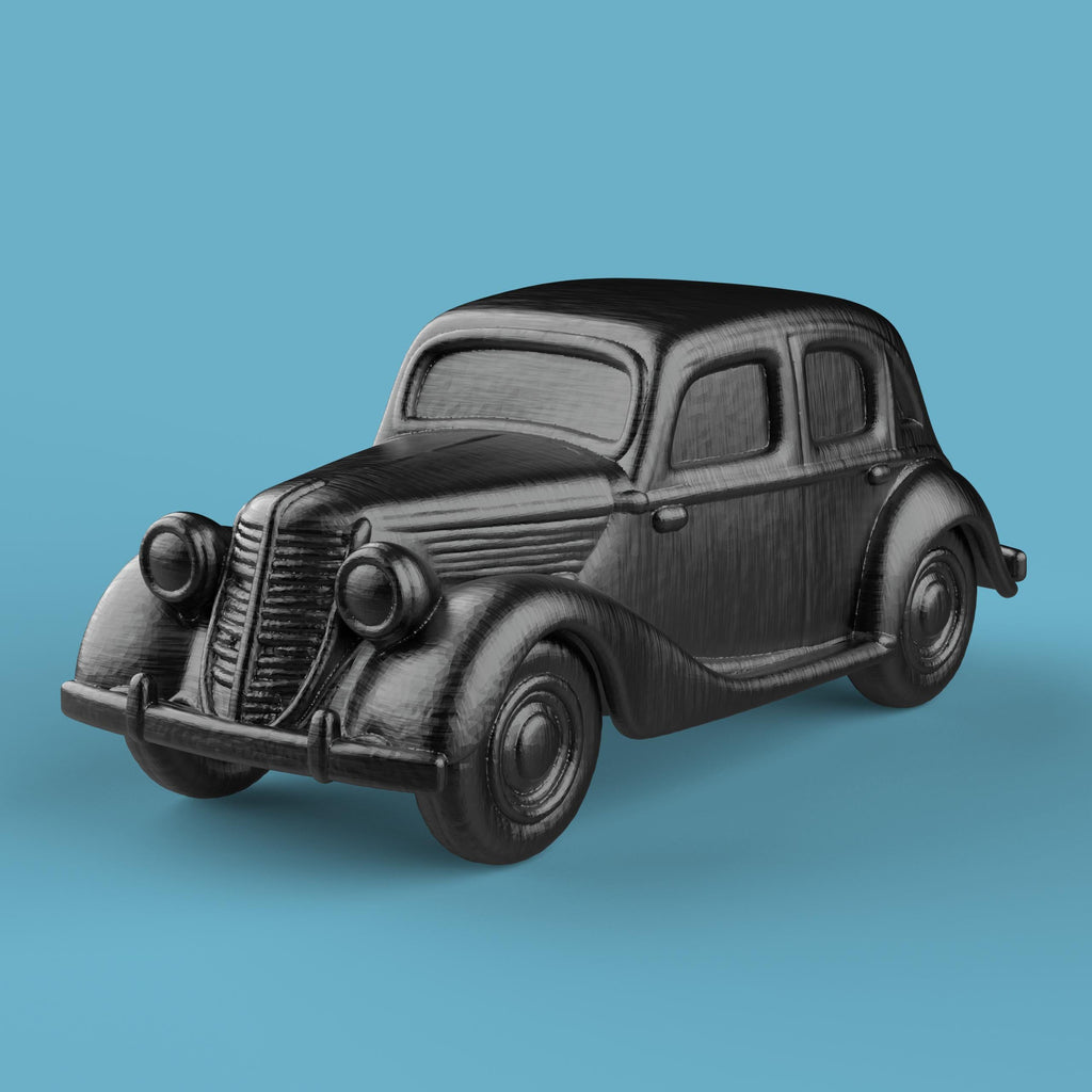 3D-printed model of a Renault 1940 BKF1 vintage car. The miniature captures smooth rounded fenders, detailed headlights, and a classic front grille design, representing the early 20th-century French automobile style.