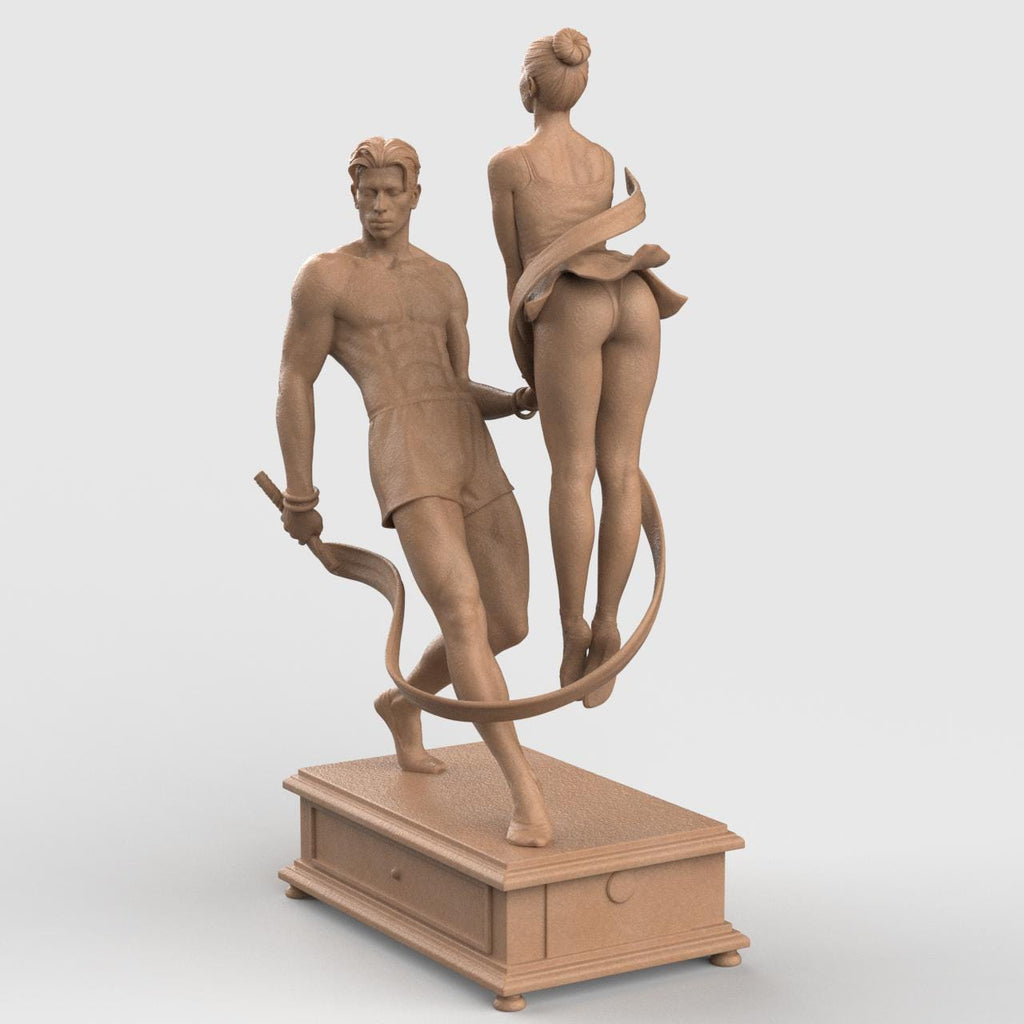 3D-printed figurine of a male and female dancer entwined with flowing ribbons, symbolizing harmony and balance. The male figure stands firm holding the ribbon while the female dancer rises gracefully on pointe, their hands interlocked. The dynamic ribbons encircle them, emphasizing movement and unity. Mounted on a rectangular decorative base.