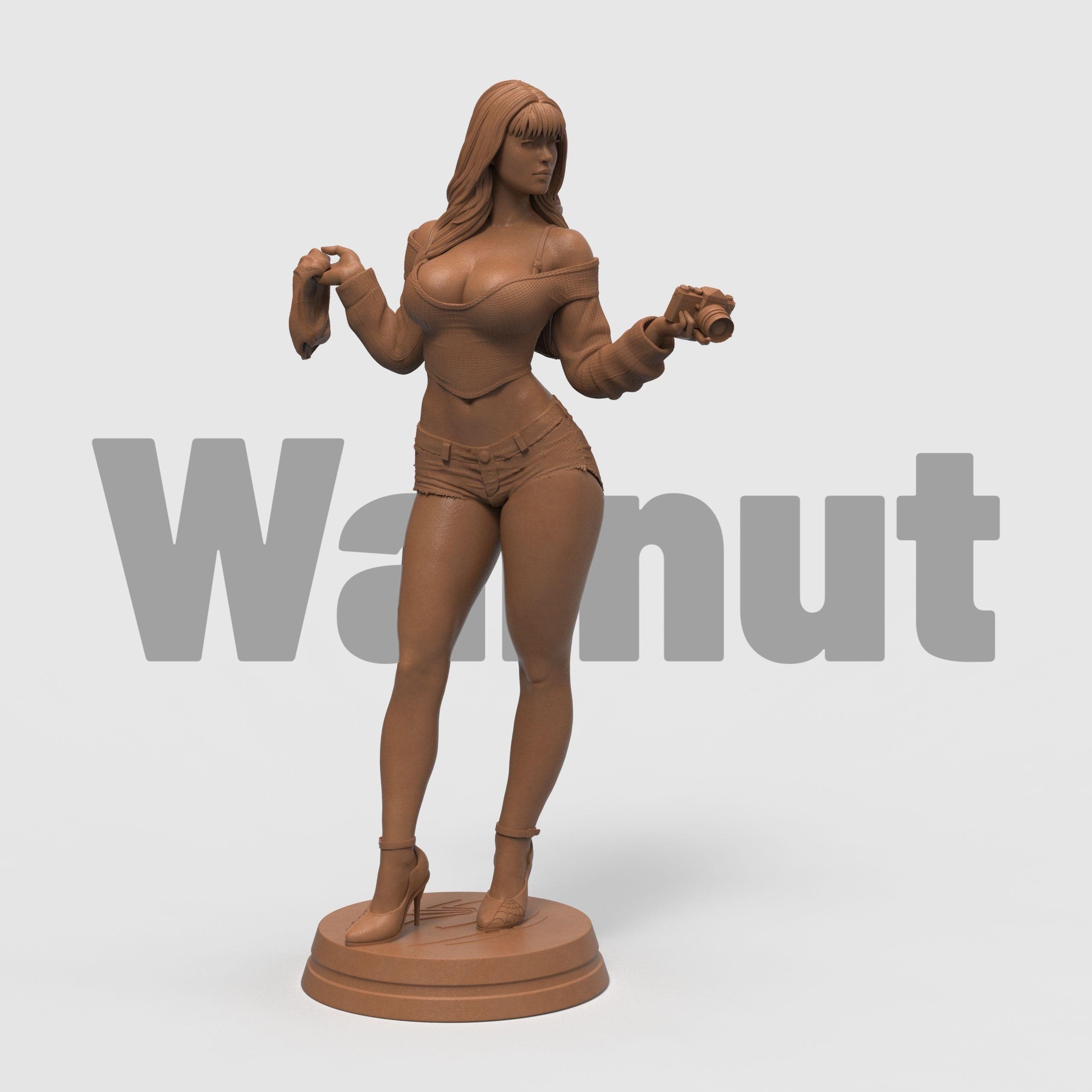 Stylized 3D-printed figurine of Mary Jane in a confident pose, holding a camera in one hand and a cloth in the other. She is dressed in a cropped sweater and short shorts, with long flowing hair and high heels. Available in bronze, gold, and silver finishes, the sculpture showcases fine detail and a modern, fashionable aesthetic.