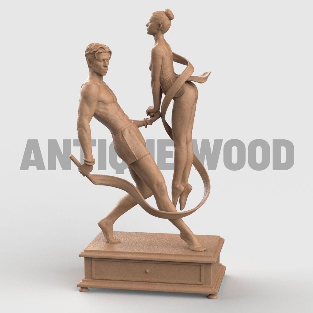 3D-printed figurine of a male and female dancer entwined with flowing ribbons, symbolizing harmony and balance. The male figure stands firm holding the ribbon while the female dancer rises gracefully on pointe, their hands interlocked. The dynamic ribbons encircle them, emphasizing movement and unity. Mounted on a rectangular decorative base.