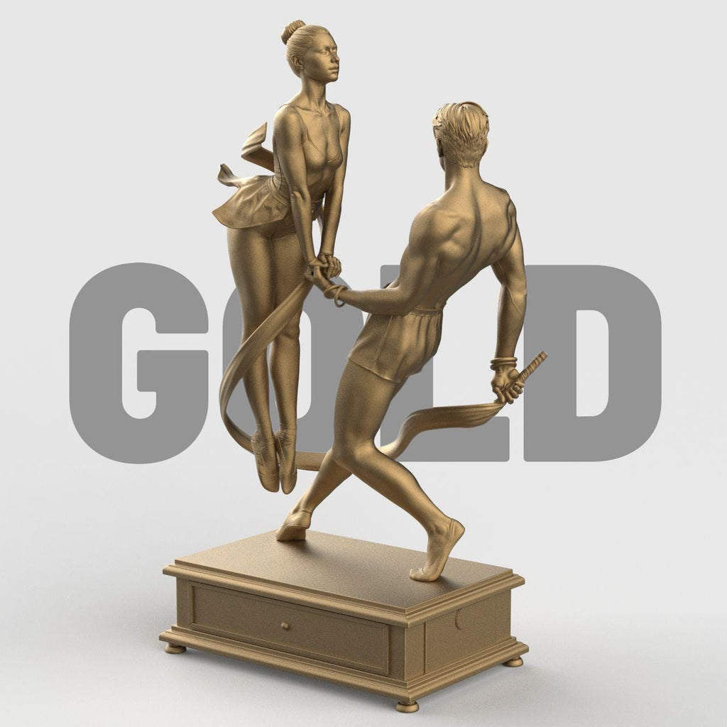 3D-printed figurine of a male and female dancer entwined with flowing ribbons, symbolizing harmony and balance. The male figure stands firm holding the ribbon while the female dancer rises gracefully on pointe, their hands interlocked. The dynamic ribbons encircle them, emphasizing movement and unity. Mounted on a rectangular decorative base.