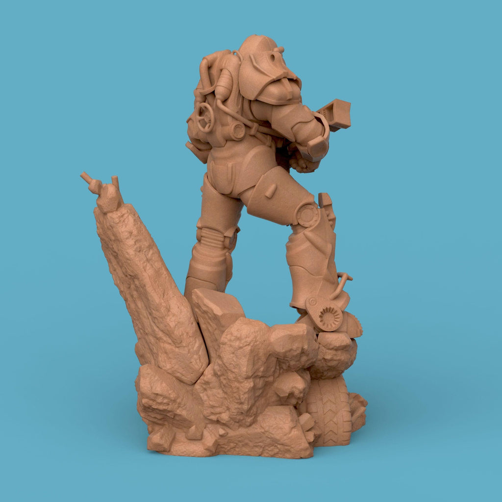 3D-printed T-60 Power Armor figurine featuring a heavily armored soldier standing on a rocky base. The detailed design showcases metallic plating, mechanical joints, and a futuristic energy weapon — a perfect collectible for sci-fi fans and post-apocalyptic enthusiasts.