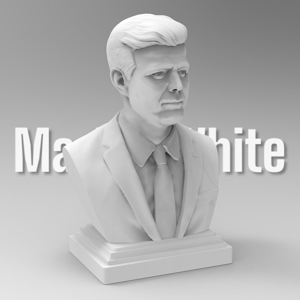 Detailed bust of John F. Kennedy, depicting the 35th U.S. president in a suit and tie with a serious, contemplative expression. The sculpture captures his distinctive hairstyle and strong features, mounted on a classic pedestal base.