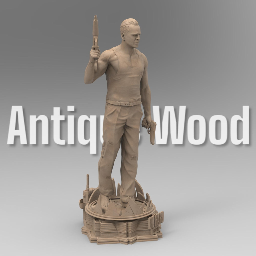 A detailed 3D-printed statue of McLane of Mayhem, posed dynamically with a machine gun and pistol, standing atop a sculpted base featuring shattered glass and city elements. Perfect for collectors and action movie fans.