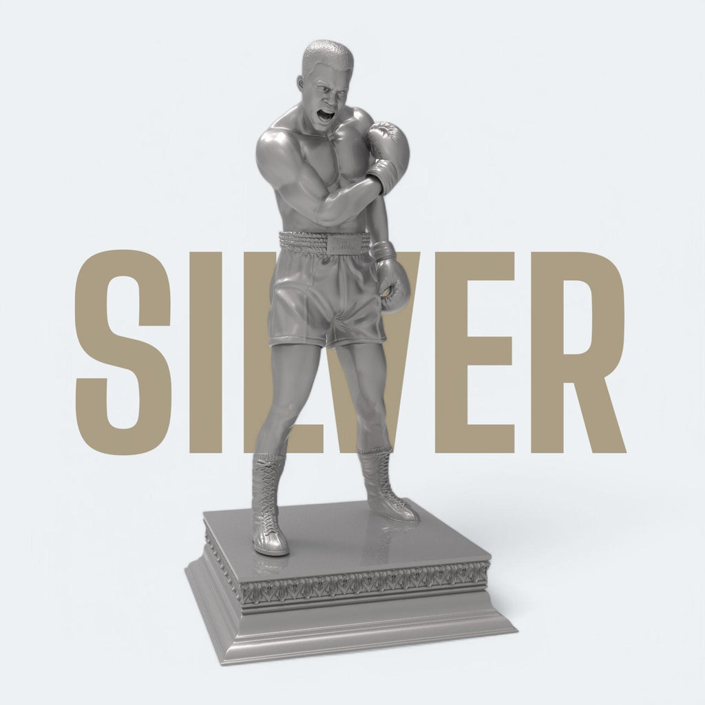 A bold tribute to the greatest of all time—this Muhammad Ali sculpture captures the raw strength and iconic energy of the boxing legend. With gloves raised and stance powerful, it’s a perfect piece for fans, collectors, and champions at heart. Available in gold and bronze finishes.