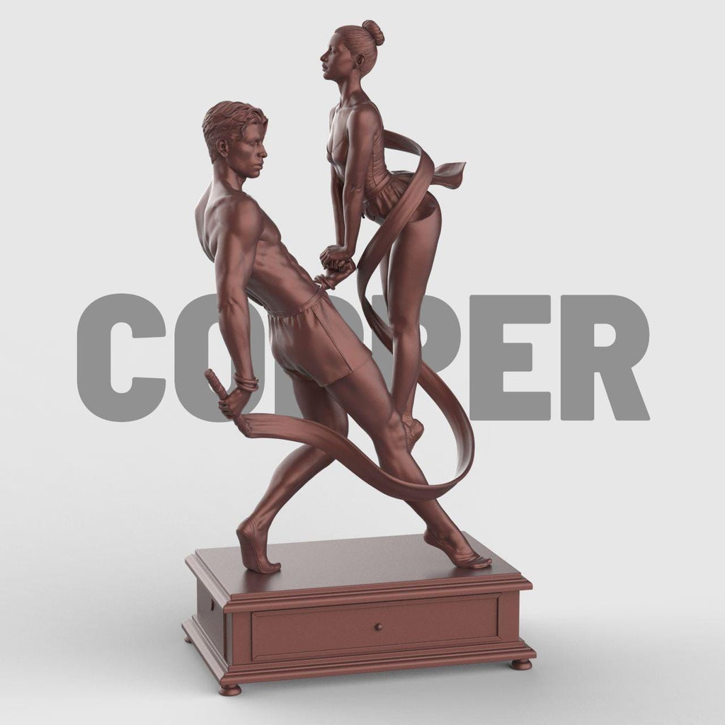 3D-printed figurine of a male and female dancer entwined with flowing ribbons, symbolizing harmony and balance. The male figure stands firm holding the ribbon while the female dancer rises gracefully on pointe, their hands interlocked. The dynamic ribbons encircle them, emphasizing movement and unity. Mounted on a rectangular decorative base.