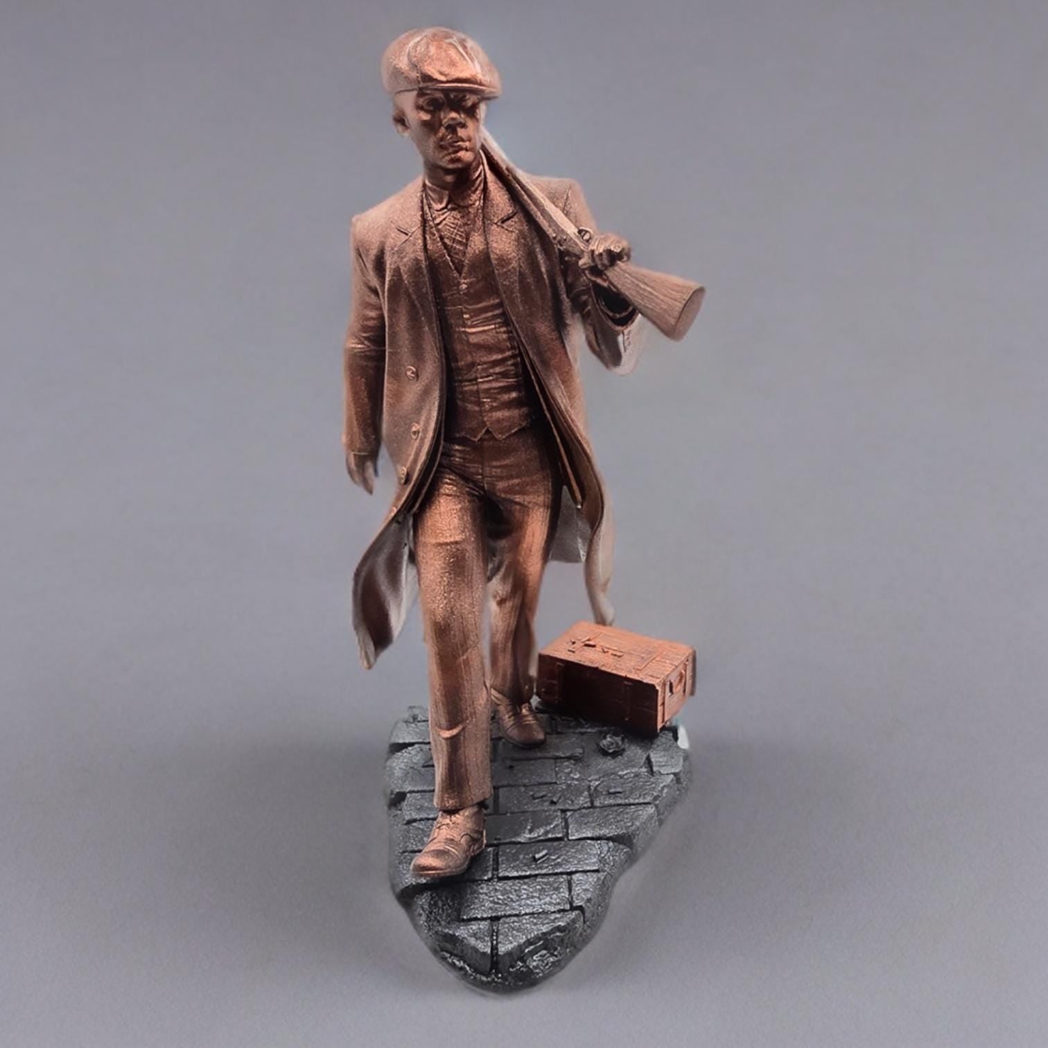 Bronze-colored 3D-printed figurine of a man in a long coat and newsboy cap, carrying a rifle. He stands on a dark gray, textured base resembling cobblestones. The figurine is detailed, showing the man&#39;s clothing and the rifle&#39;s features.  The overall style suggests a gangster or historical figure theme. The figurine is a collectible item, suitable for display.