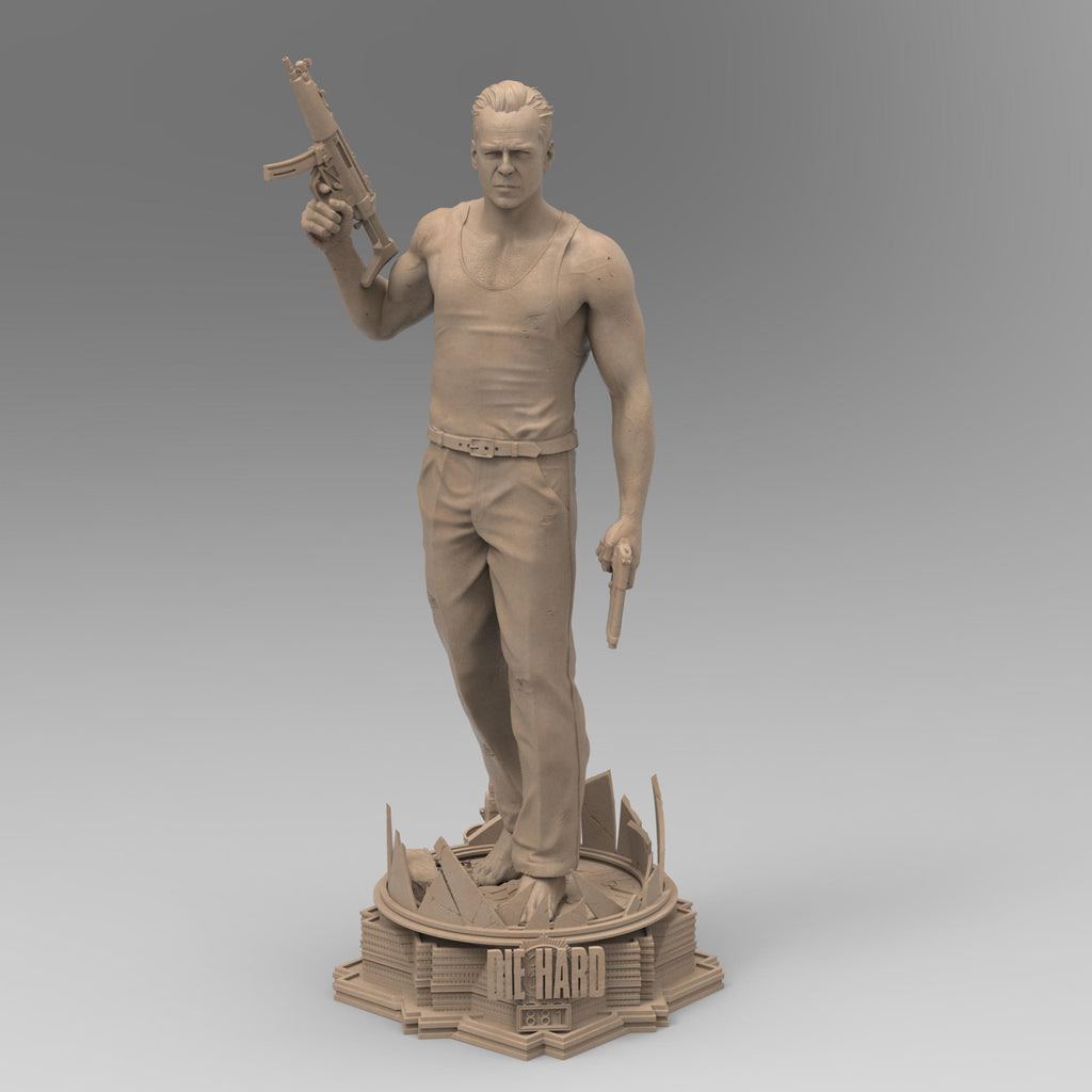 A detailed 3D-printed statue of McLane of Mayhem, posed dynamically with a machine gun and pistol, standing atop a sculpted base featuring shattered glass and city elements. Perfect for collectors and action movie fans.
