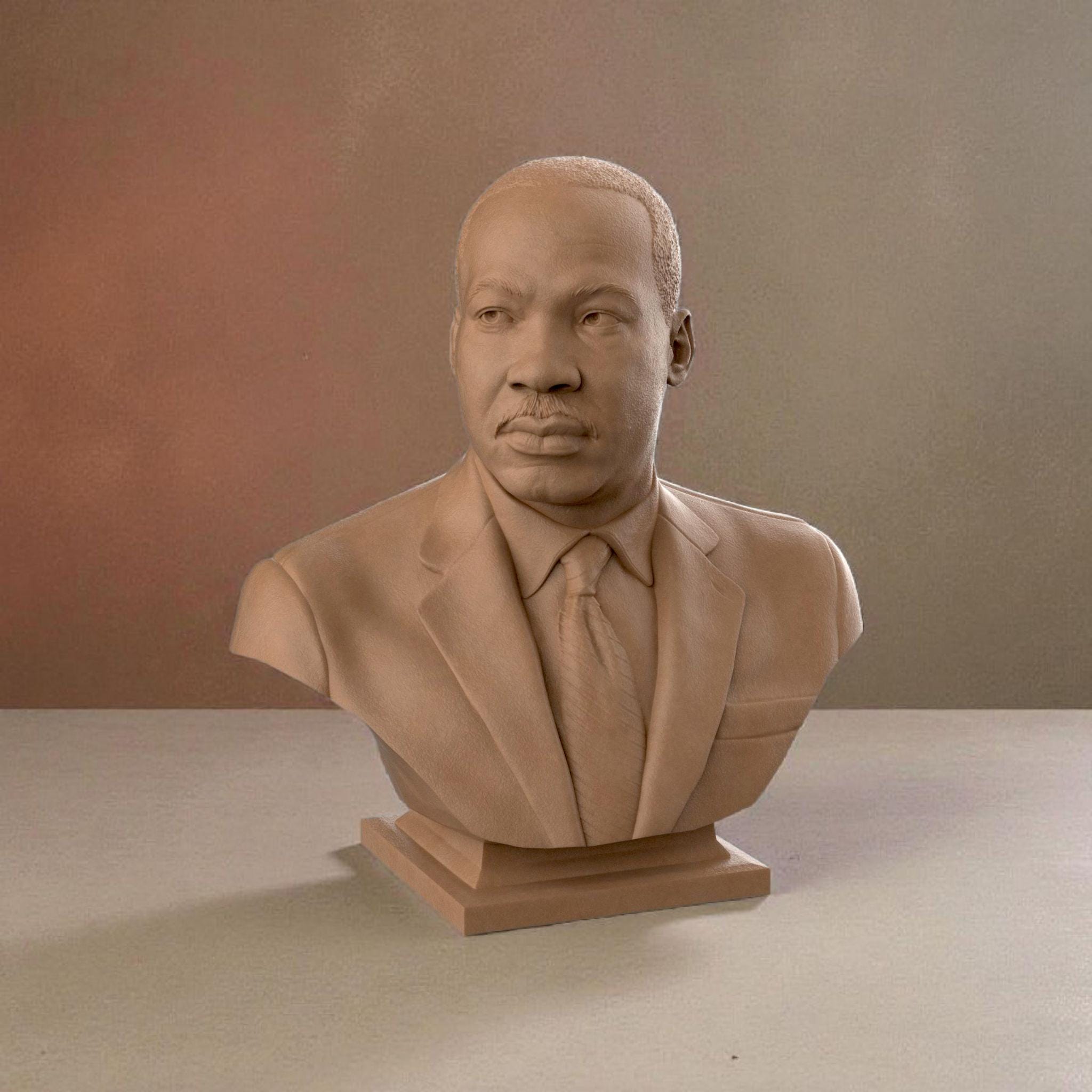 3D-printed bust of Martin Luther King Jr. in a suit and tie, capturing his determined expression with fine detailing, ideal for collectors, tributes, or display décor.
