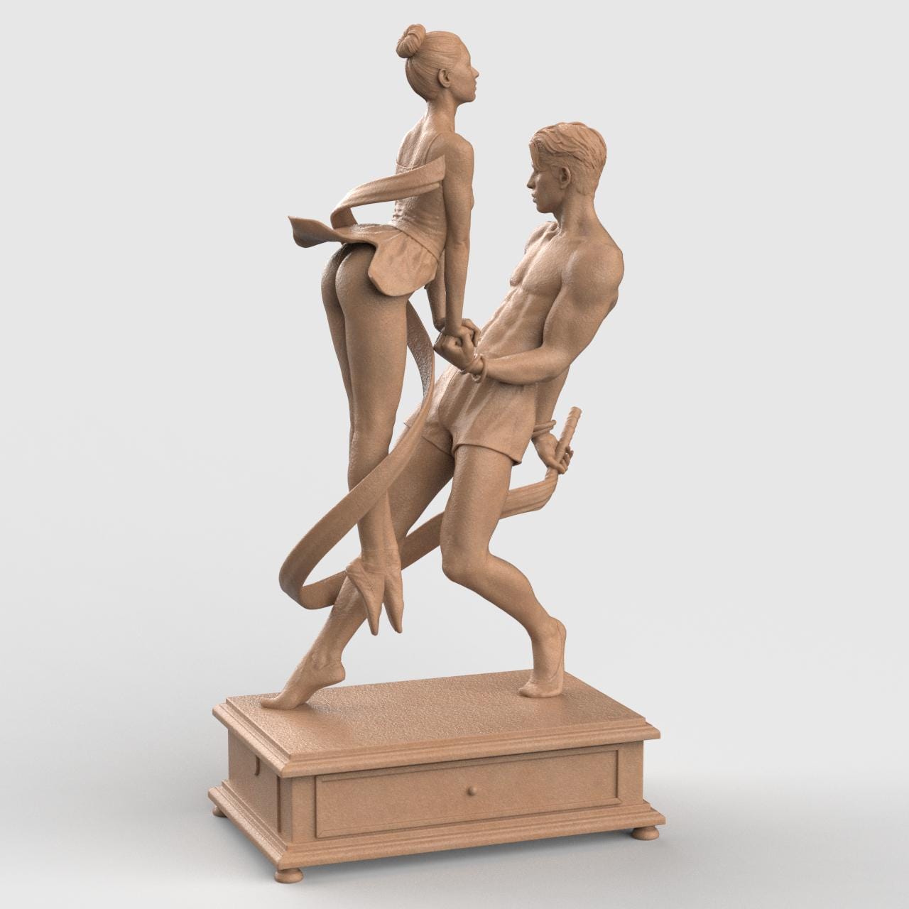 3D-printed figurine of a male and female dancer entwined with flowing ribbons, symbolizing harmony and balance. The male figure stands firm holding the ribbon while the female dancer rises gracefully on pointe, their hands interlocked. The dynamic ribbons encircle them, emphasizing movement and unity. Mounted on a rectangular decorative base.
