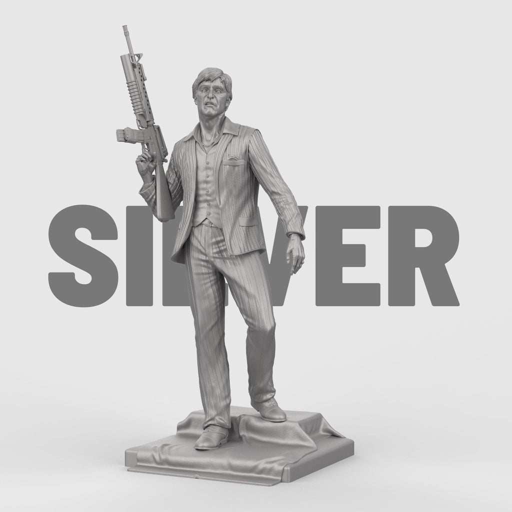 3D-printed statue inspired by Scarface, depicting a suited man in a confident pose, holding an assault rifle over his shoulder. The figure wears a detailed pinstripe suit and stands atop a textured base, capturing a bold and iconic cinematic moment with lifelike facial expression and dynamic stance.