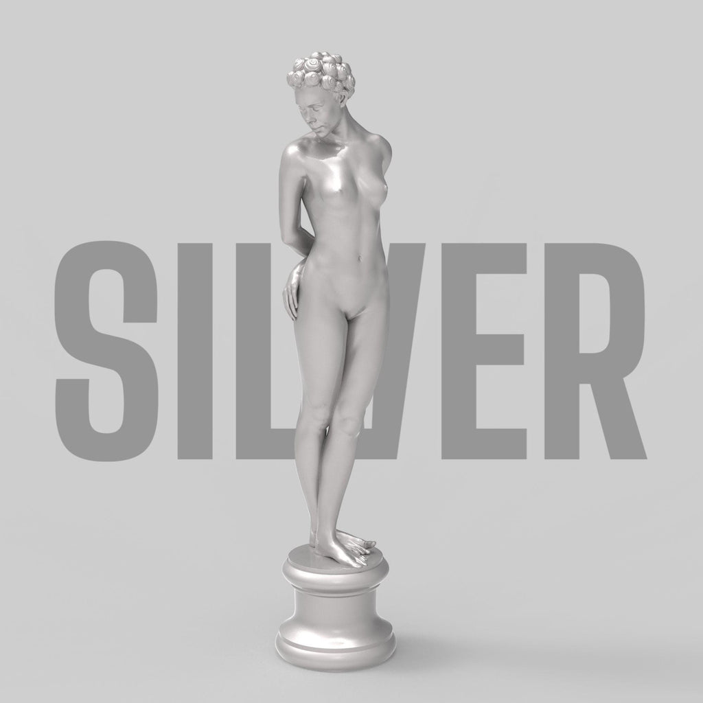 Elegant minimalist sculpture of a nude woman with vintage hair rollers, posed shyly on a round pedestal. “The Woman X” combines classical grace and modern rebellion in one striking collectible.