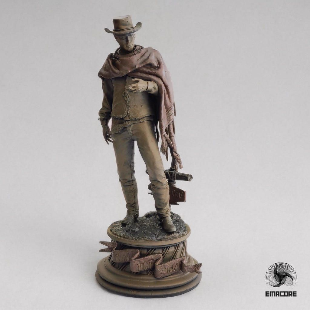 Statue of Clint Eastwood in a cowboy outfit, featuring a poncho, hat, and revolver, standing on a detailed round base with decorative elements.