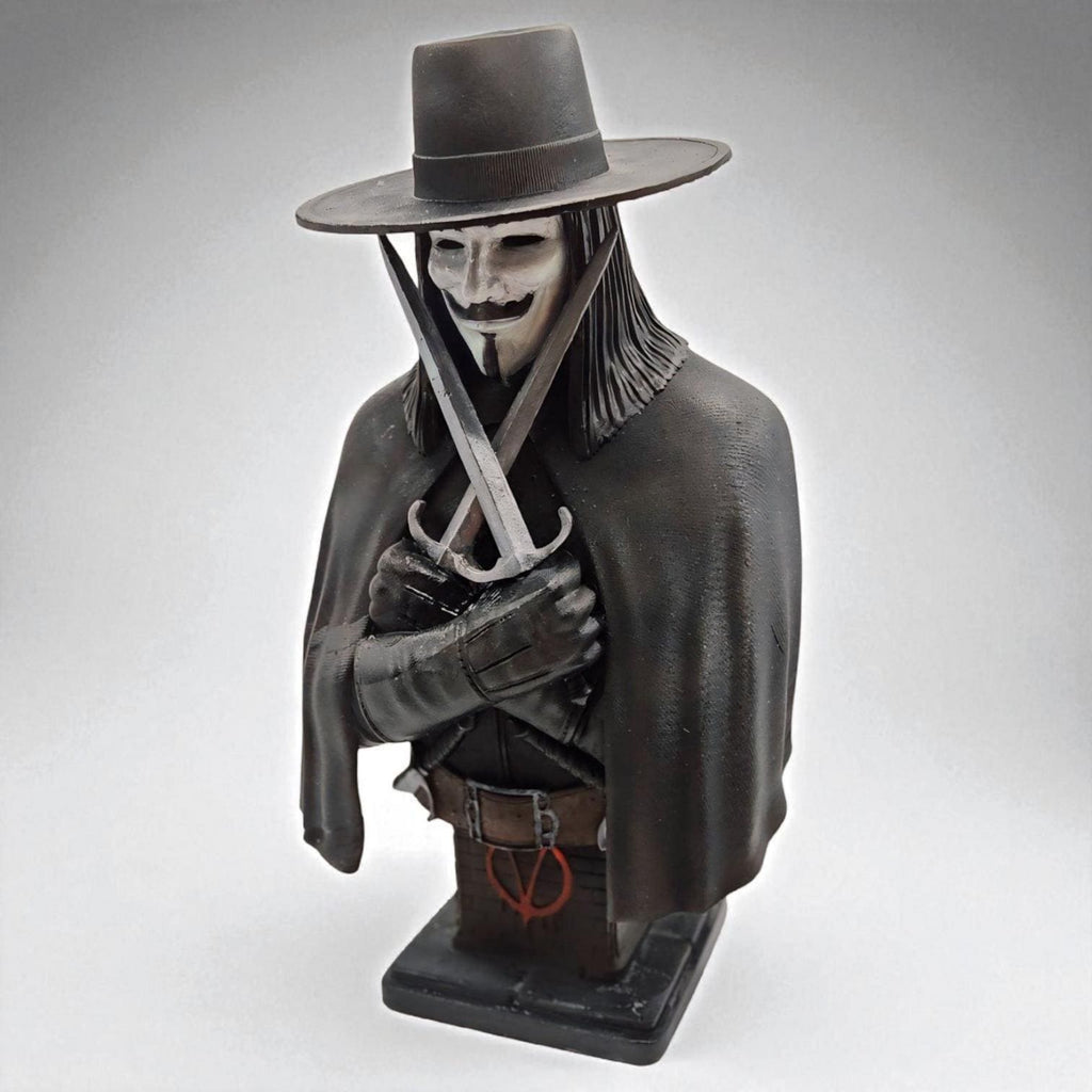 3D-printed bust of Vendetta, featuring a masked figure in a wide-brimmed hat and cloak. The character holds two crossed daggers at the chest, embodying a mysterious and rebellious presence.