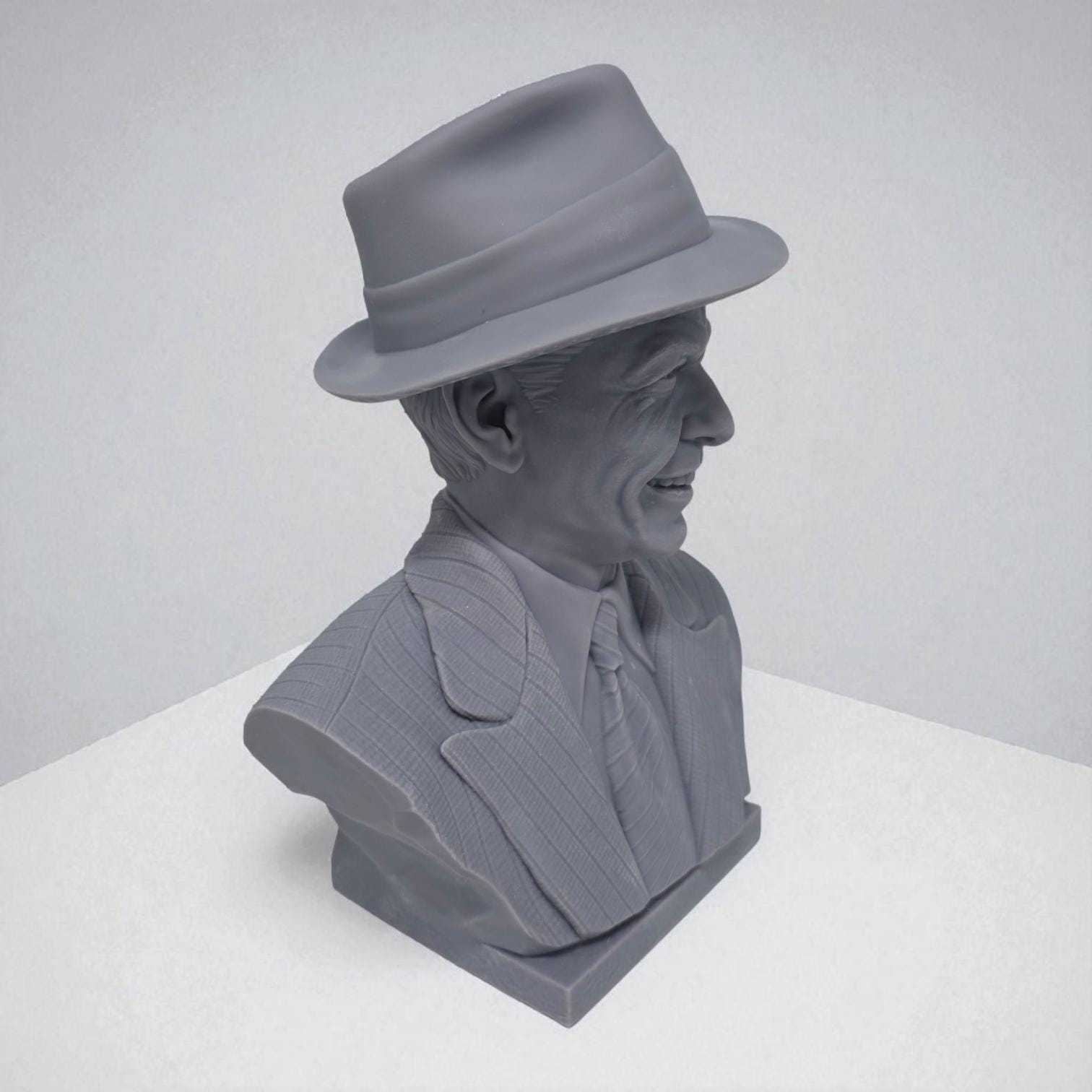 3D-printed bust of Frank Sinatra wearing a classic fedora and suit with a wide smile, showcasing detailed facial features and textured clothing. A tribute piece perfect for fans, collectors, or display décor.