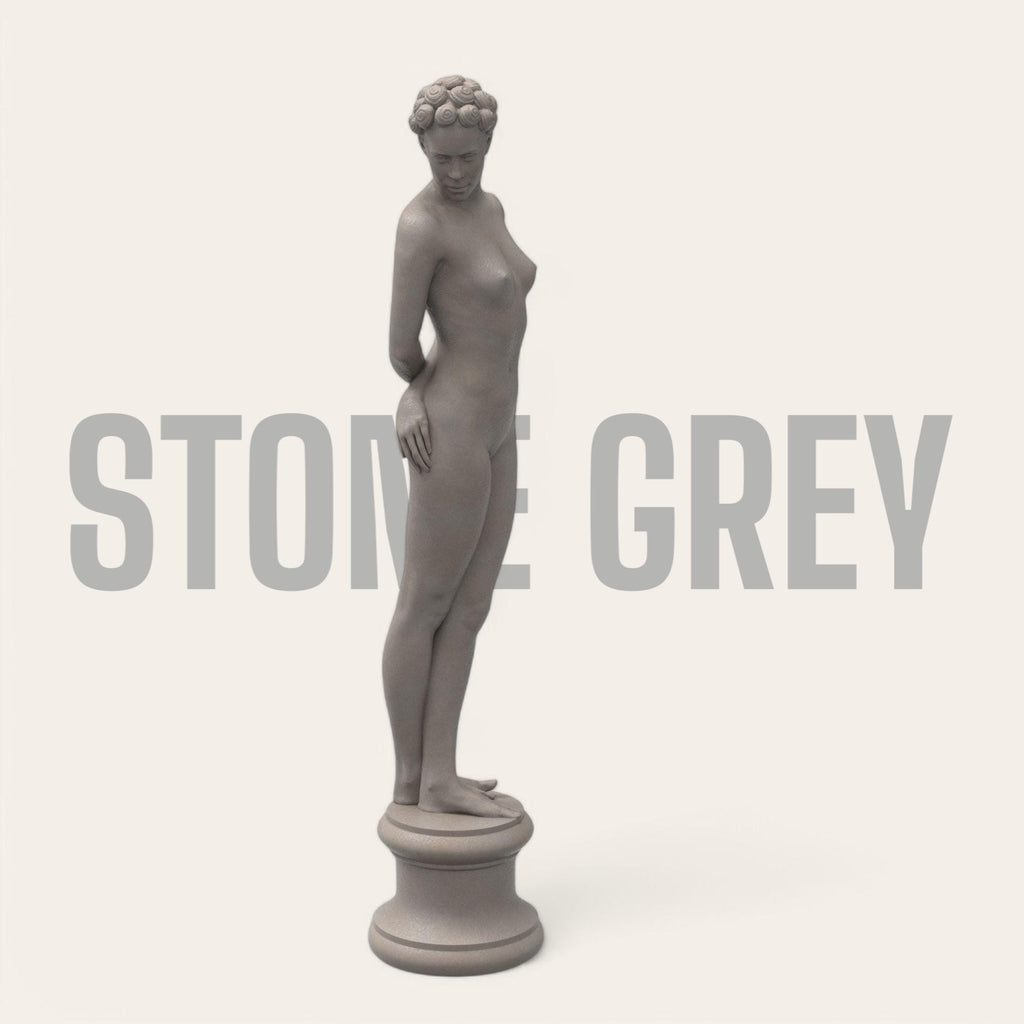 Elegant minimalist sculpture of a nude woman with vintage hair rollers, posed shyly on a round pedestal. “The Woman X” combines classical grace and modern rebellion in one striking collectible.