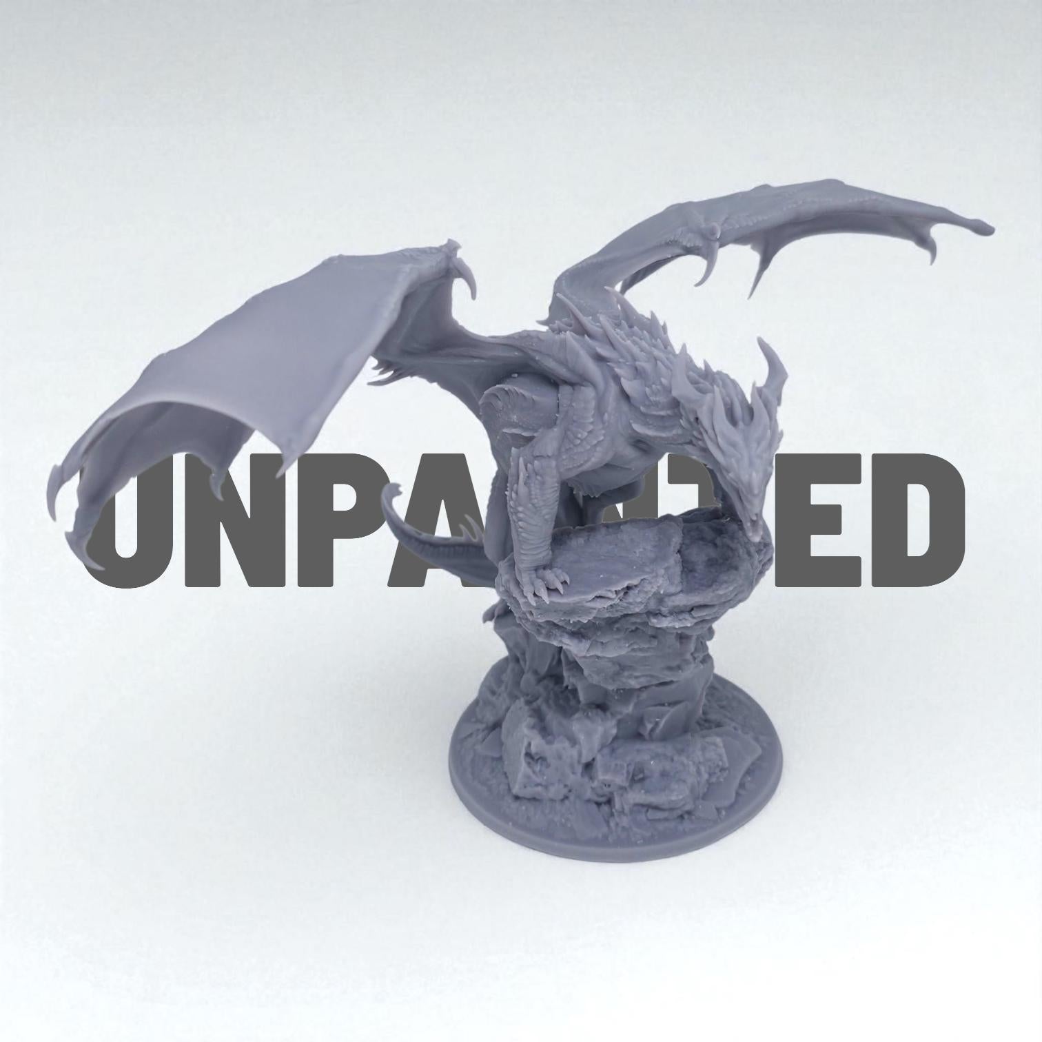 A fearsome Chromatic Red Dragon perches atop a rocky outcrop, wings spread wide and mouth open in a menacing roar. Its scales are rugged and spiked, exuding raw power and dominance. A perfect miniature for collectors and tabletop RPG enthusiasts.