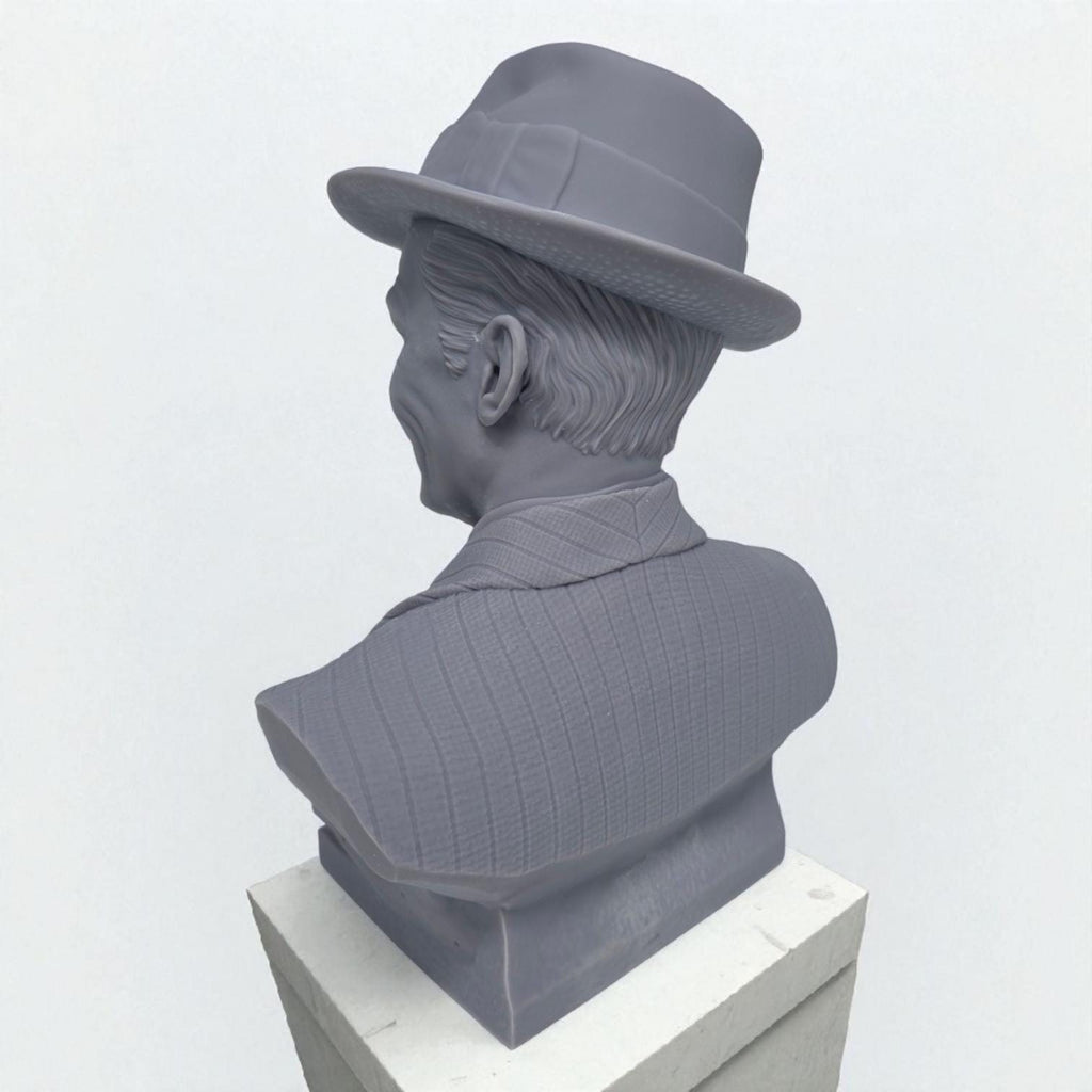 3D-printed bust of Frank Sinatra wearing a classic fedora and suit with a wide smile, showcasing detailed facial features and textured clothing. A tribute piece perfect for fans, collectors, or display décor.