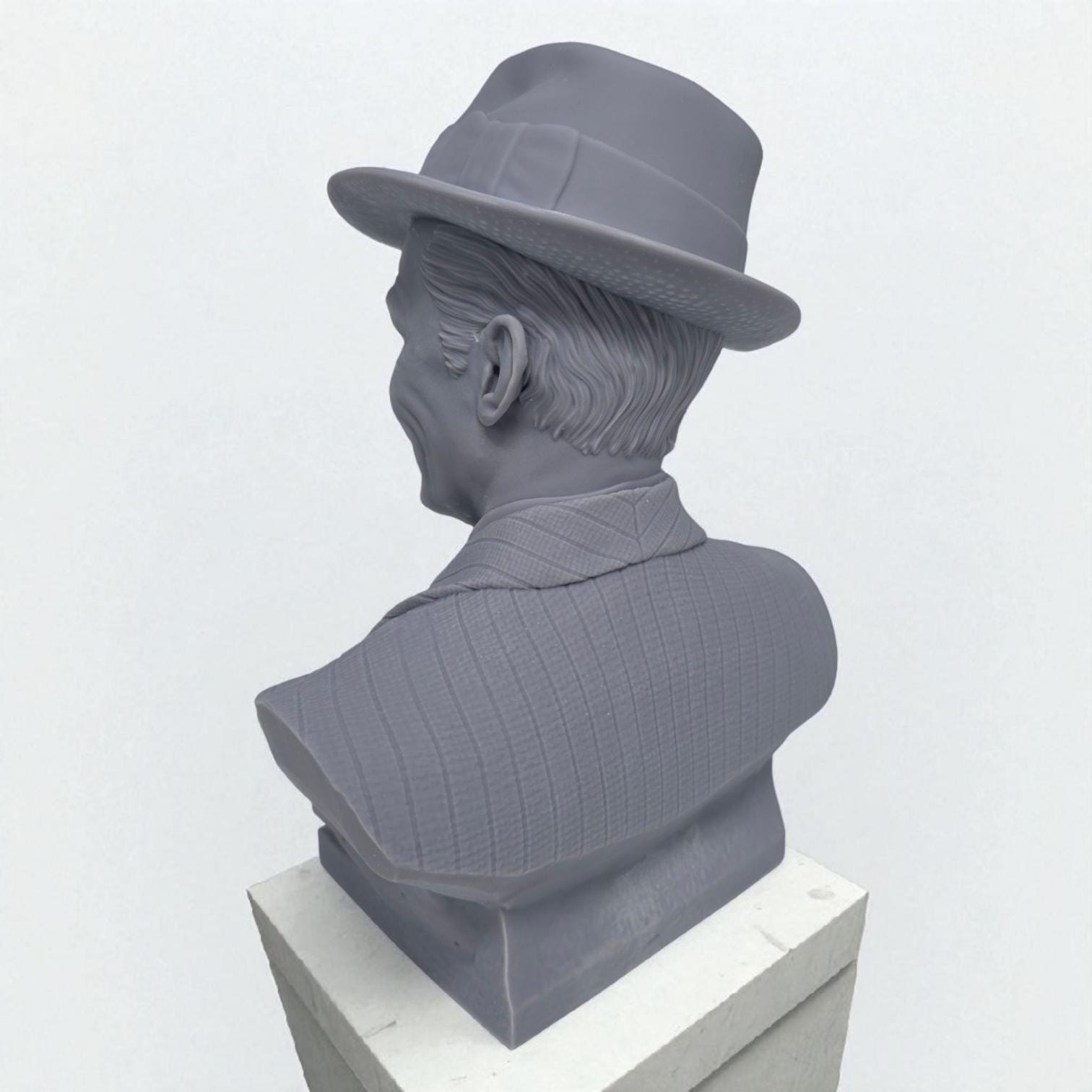 3D-printed bust of Frank Sinatra wearing a classic fedora and suit with a wide smile, showcasing detailed facial features and textured clothing. A tribute piece perfect for fans, collectors, or display décor.