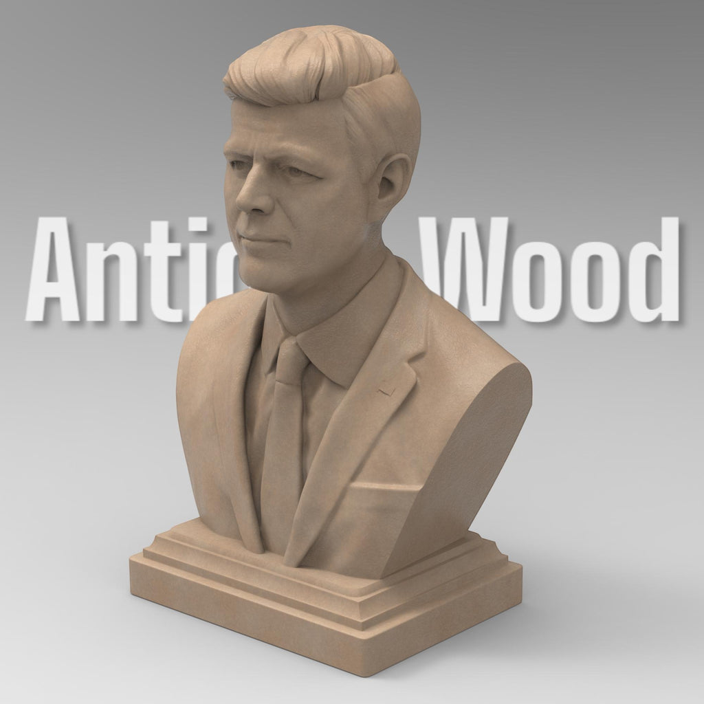 Detailed bust of John F. Kennedy, depicting the 35th U.S. president in a suit and tie with a serious, contemplative expression. The sculpture captures his distinctive hairstyle and strong features, mounted on a classic pedestal base.